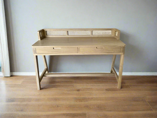 Minimalist wooden desk made of teak with curved legs and cane detailing