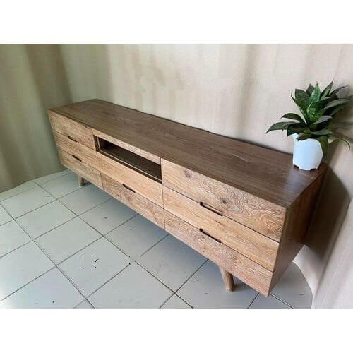 rustic teak TV unit from Souren Furniture is the perfect addition to any living area. With 8 drawers