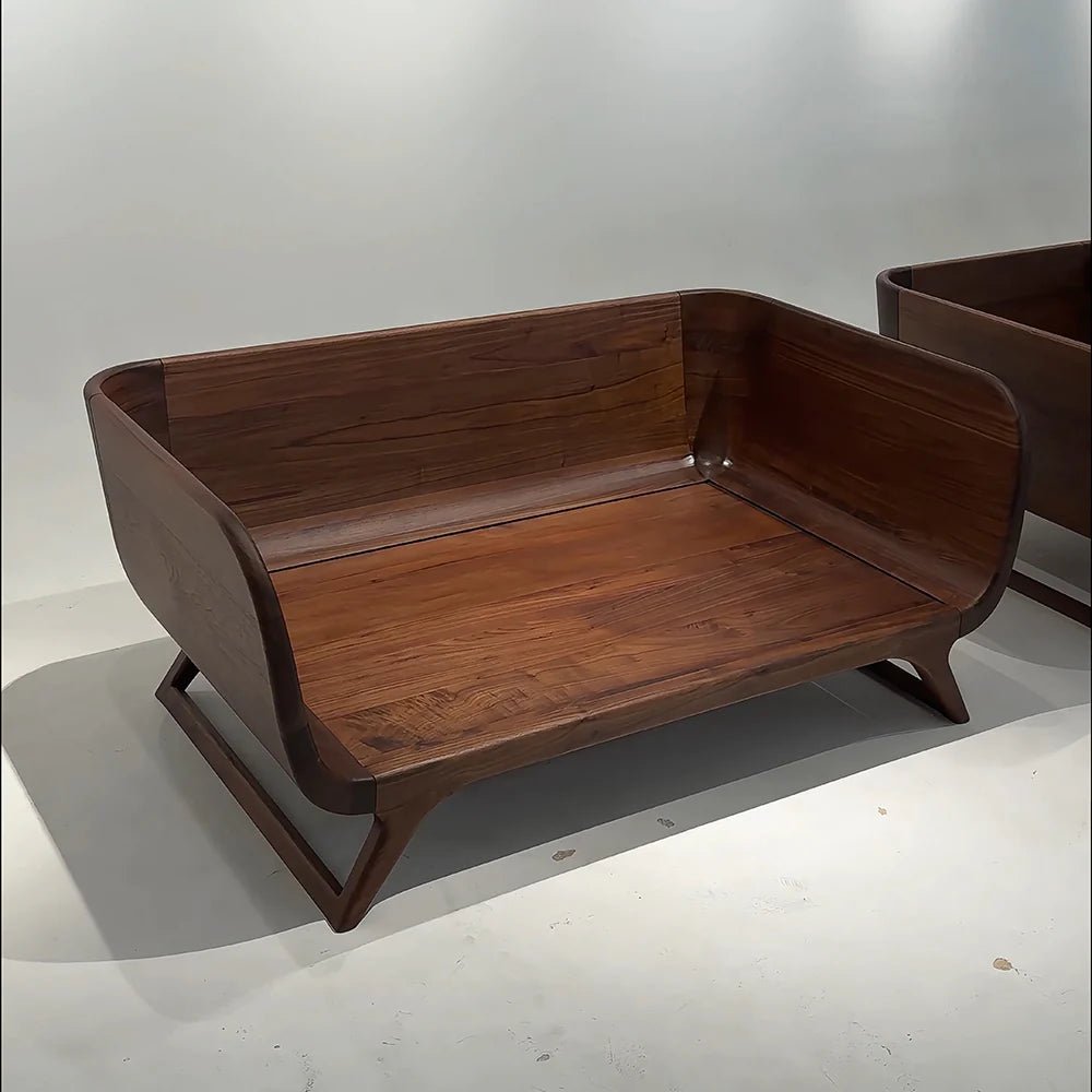 Wooden bench on a white floor with a plain background