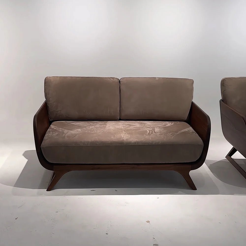 Brown sofa with wooden frame on a white background