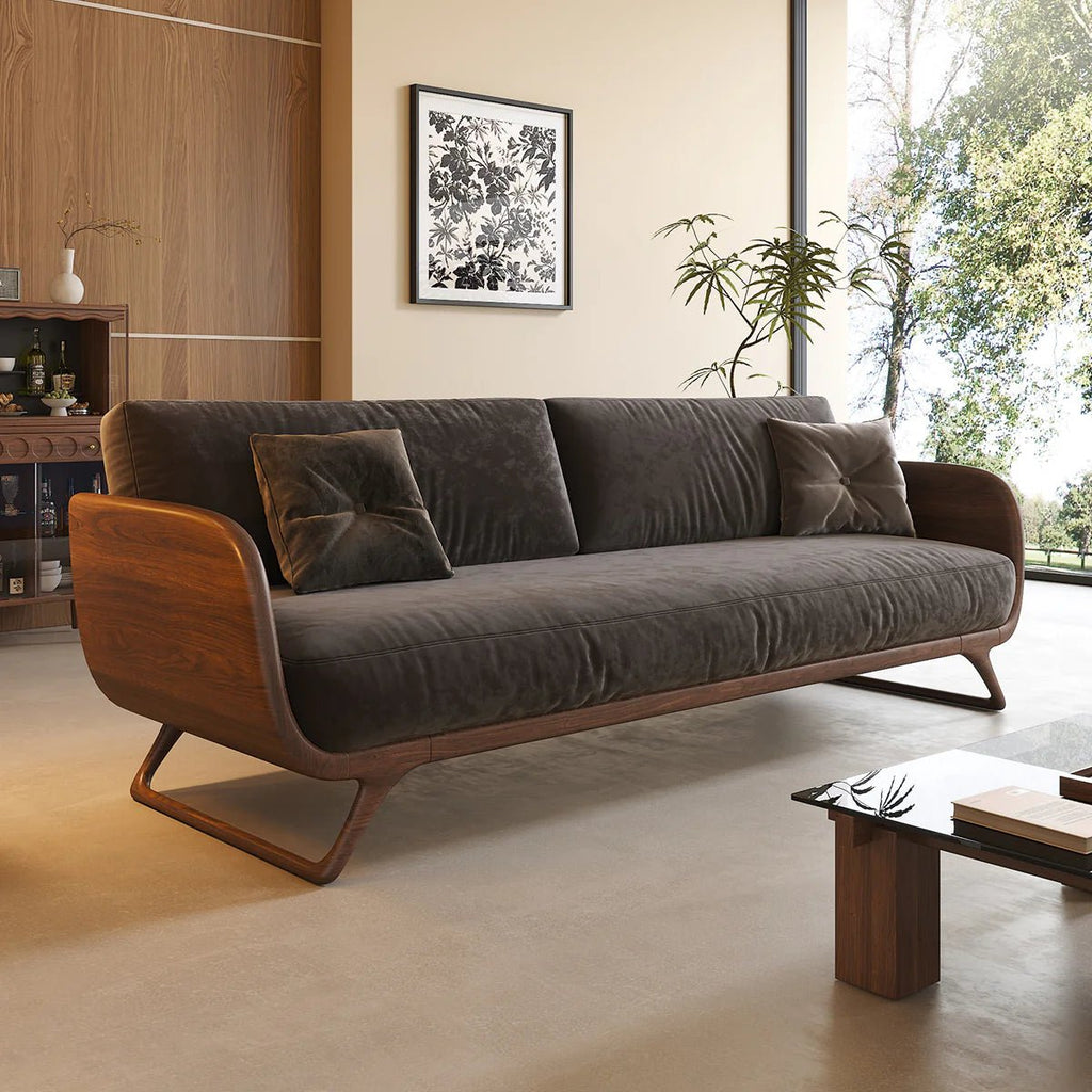 Brown sofa in a living room with a coffee table and decorative elements.