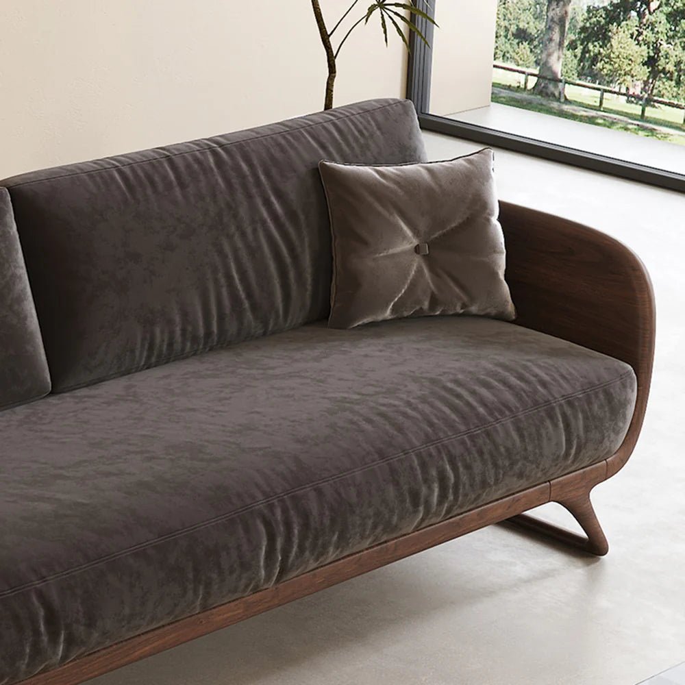 Gray sofa with wooden legs in a modern living room setting