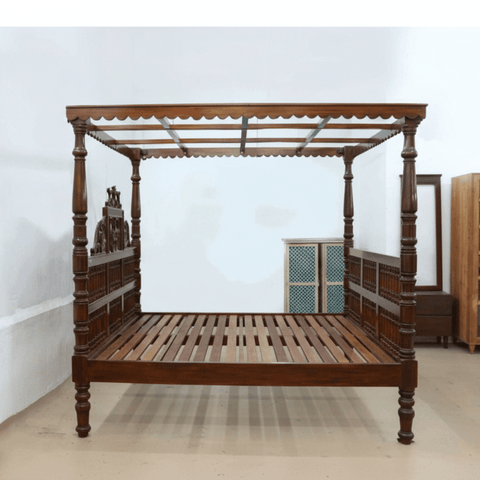 South Indian four poster teakwood bed with carved pillars with wooden slats