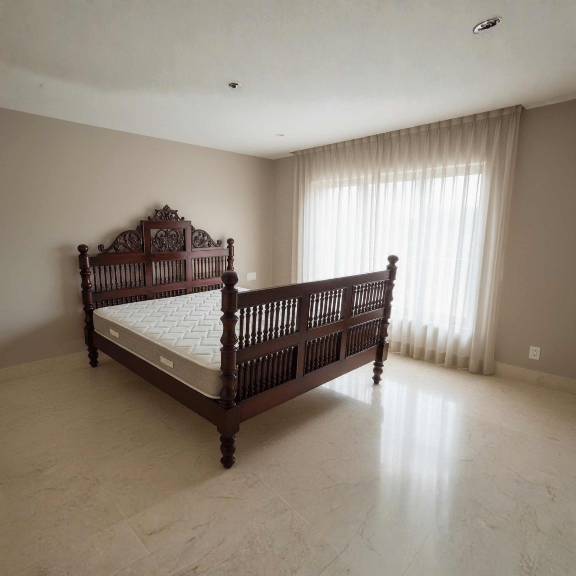 Solid teak wood bed with carved South Indian headboard in a modern bedroom