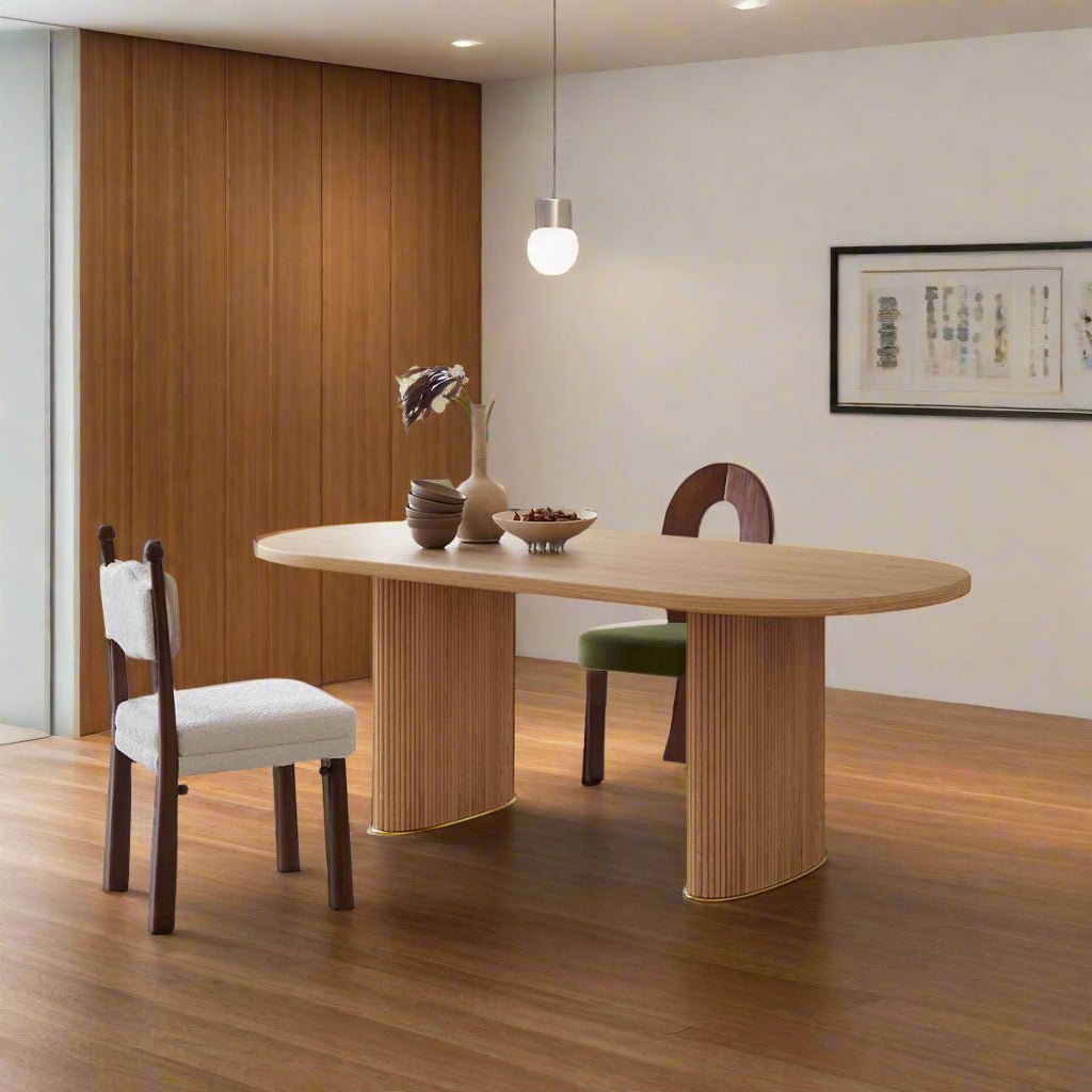 Dining room with a wooden table and chairs in a well-lit room.