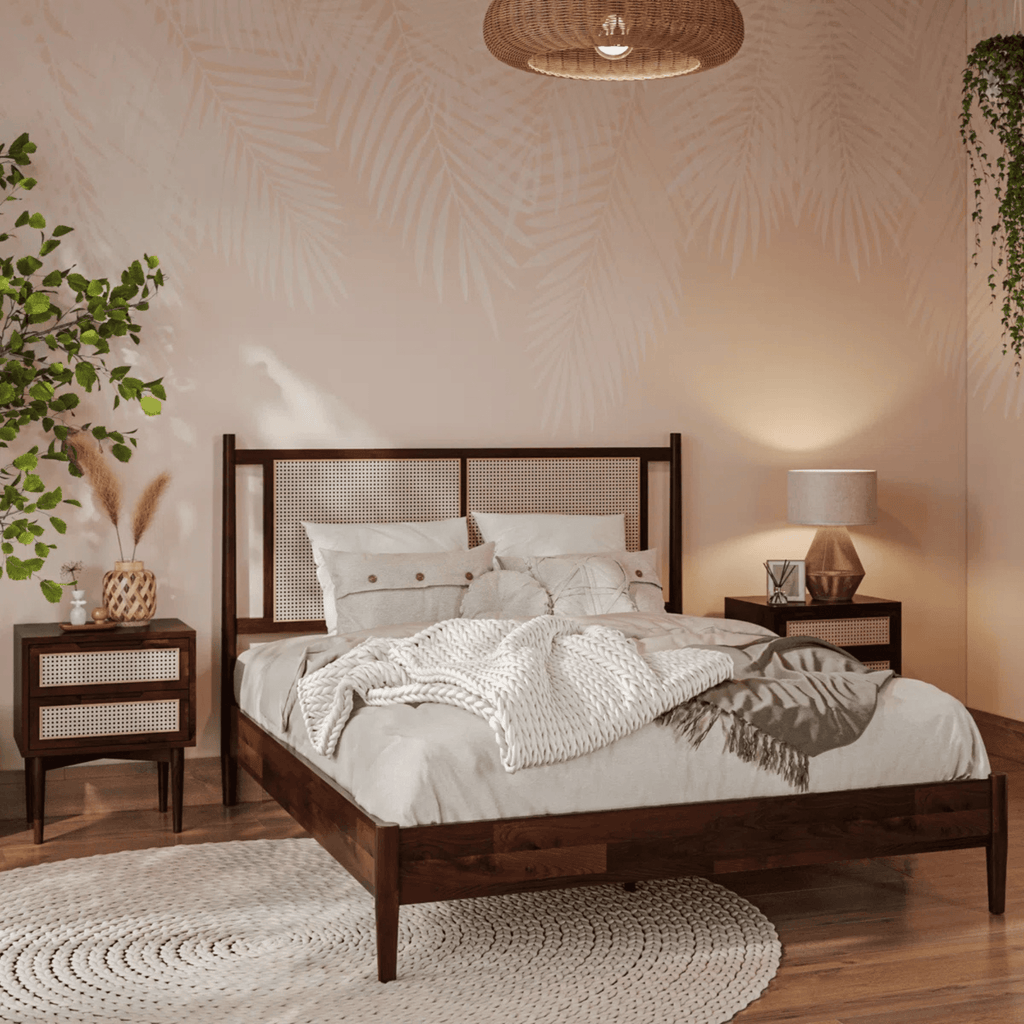 Solid teak wood bed styled with neutral bedding in Indian bedroom
