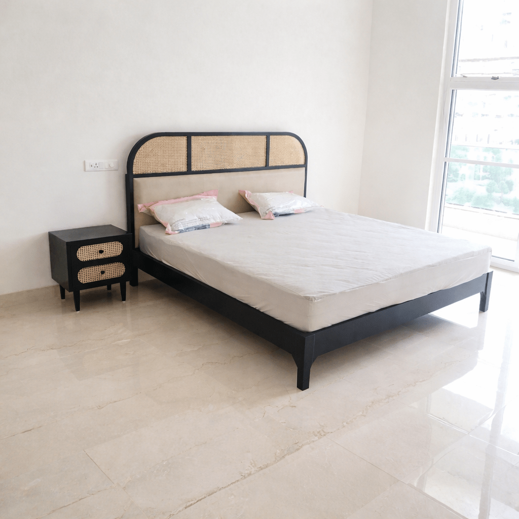 Modern cane upholstered teak wood bed with mattress in black finish, handcrafted headboard design