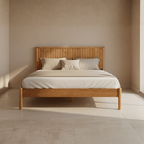 Natural teak wood bed with mattress placed, front view showing clean lines and solid wood frame