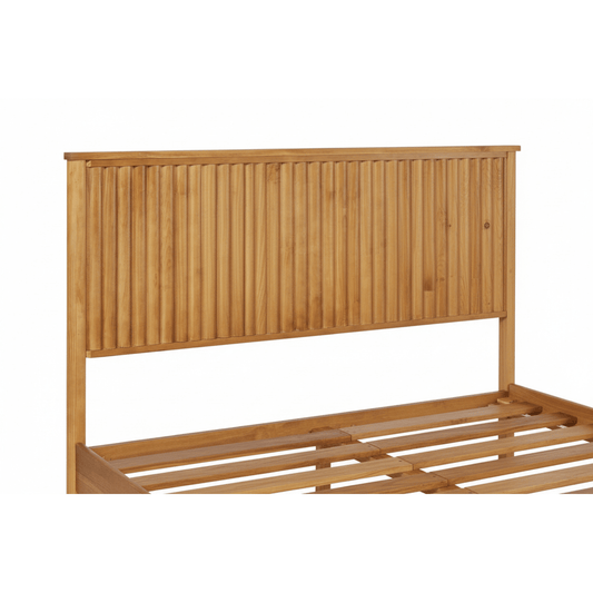 Close-up of natural teak wood vertical slatted headboard showing wood grain and craftsmanship