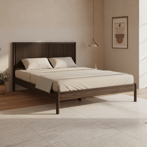 Angled view of teak wood bed in modern bedroom interior with natural finish