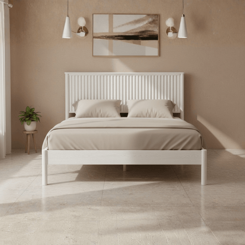 Teak wood bed frame shown in white finish with bedding in contemporary bedroom