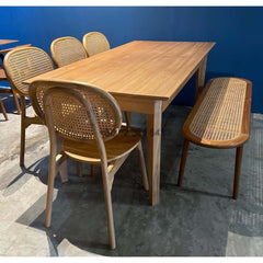Teak Wood Dining Table Set, featuring five natural rattan chairs and a long rattan bench