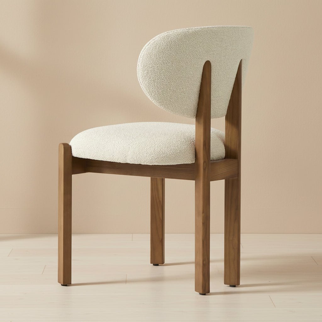 solid teak dining chair with rounded upholstered backrest and cushioned seat