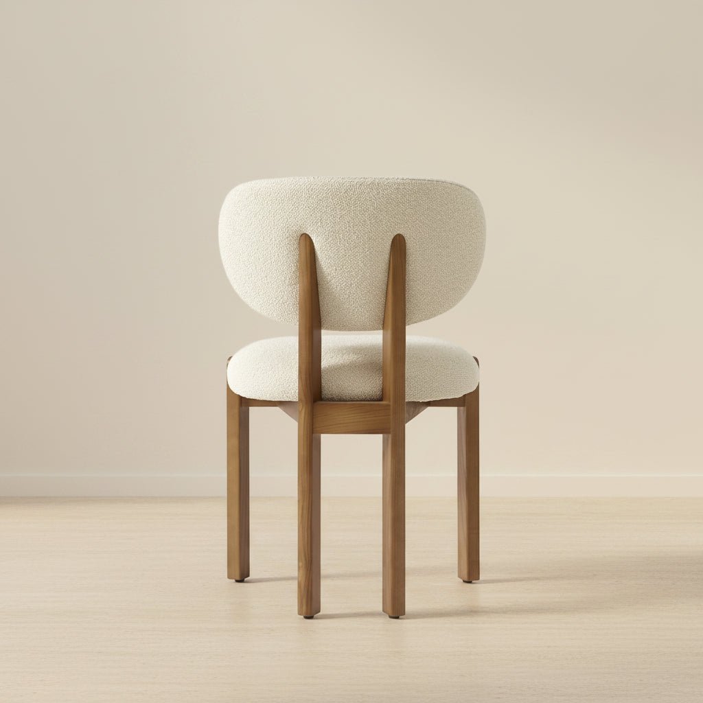 solid teak dining chair with rounded upholstered backrest and cushioned seat