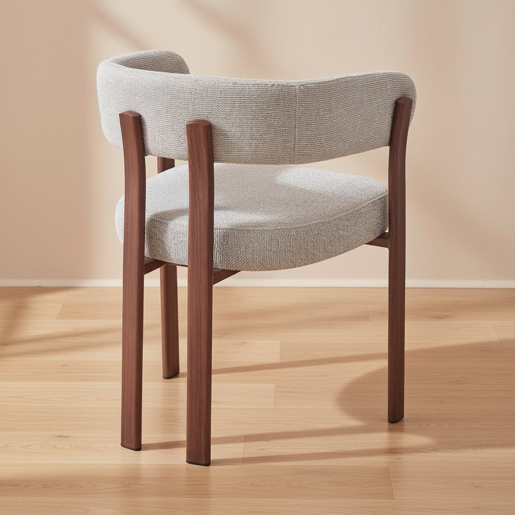 wraparound solid teak dining chair with curved upholstered back and cushioned seat