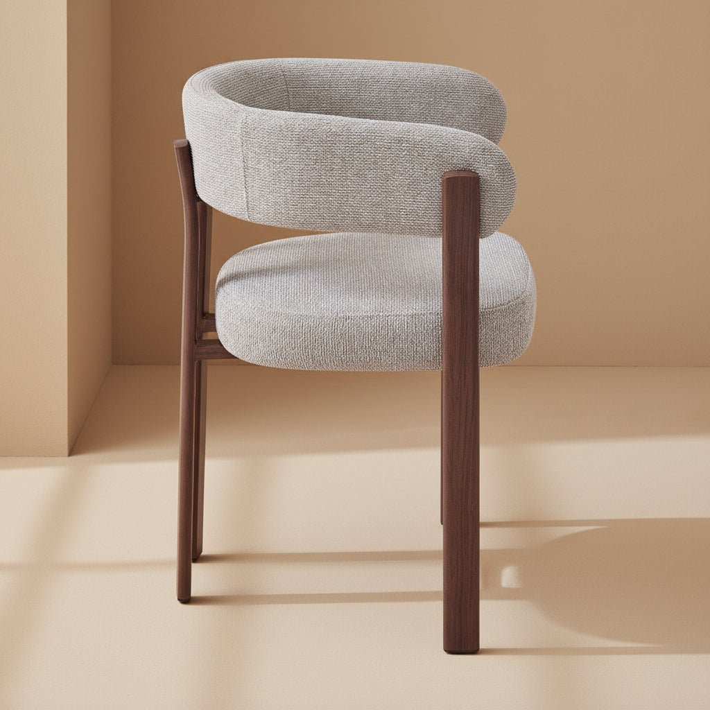 wraparound solid teak dining chair with curved upholstered back and cushioned seat