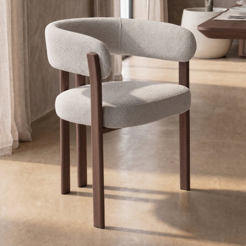 wraparound solid teak dining chair with curved upholstered back and cushioned seat