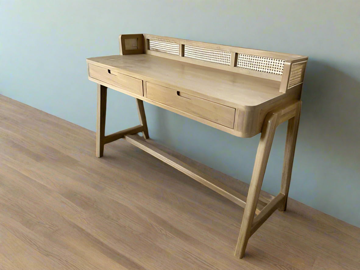 Minimalist wooden desk made of teak with curved legs and cane detailing