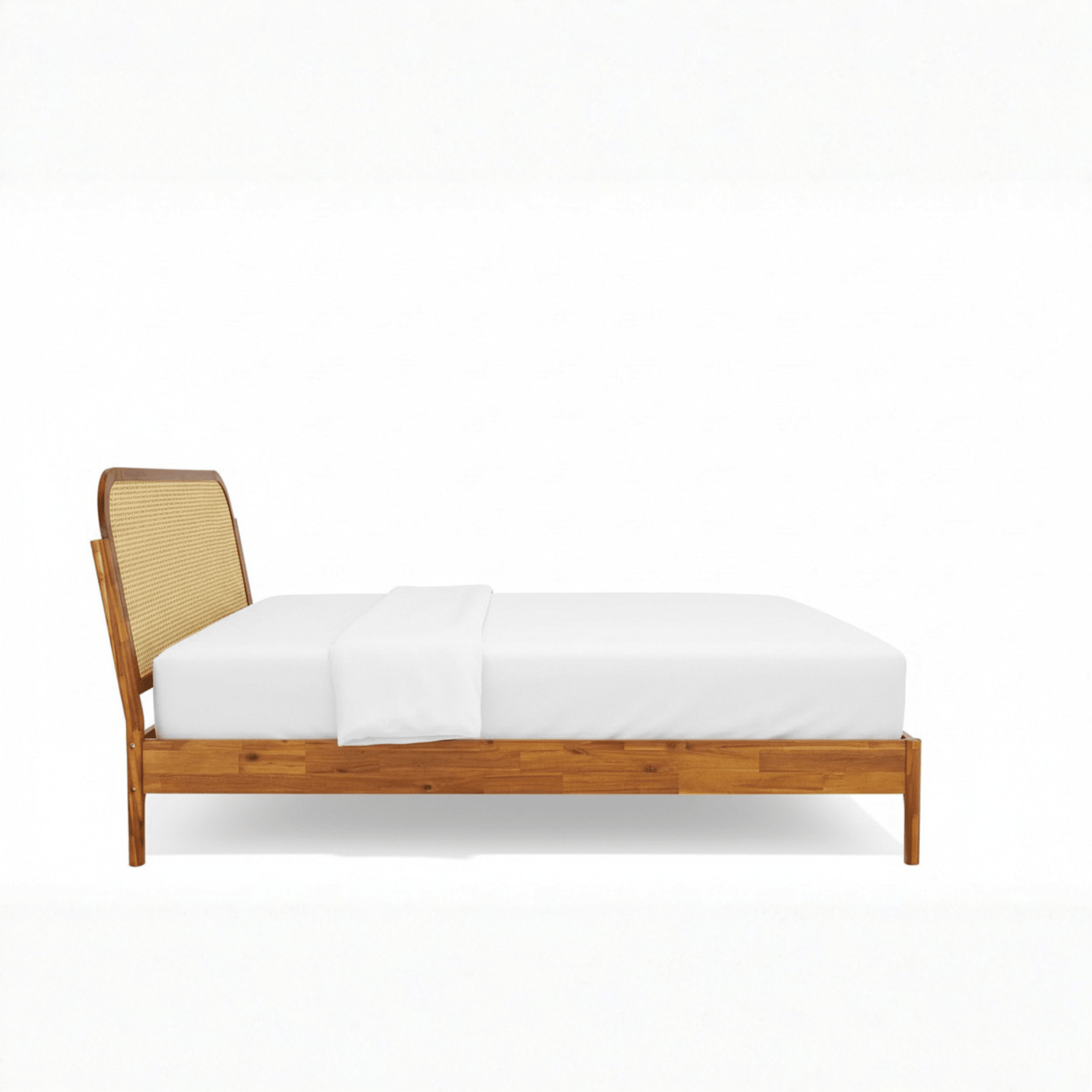 Side profile of teak wood cane bed with sleigh headboard on white background