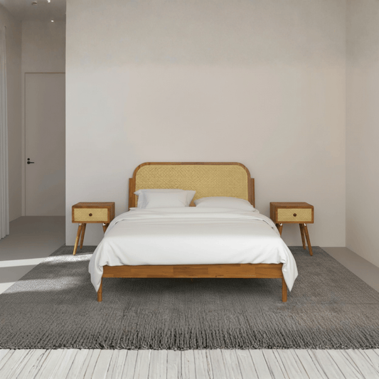 Front view of teak wood cane bed with sleigh headboard in king size bedroom setting